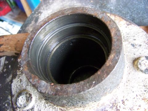 1995 Mercury Grand Marquis - A close-up view of a worn wheel bearing housing, showing internal wear and rust.