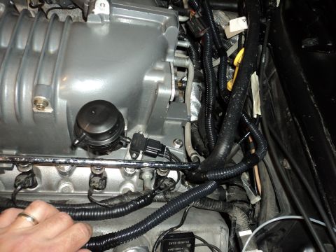 2004 Mercury Grand Marquis - This image shows engine components, including a supercharger, with various wires and sensors connected.