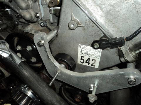 2004 Mercury Grand Marquis - Close-up of an engine part with a label that has letters and numbers.