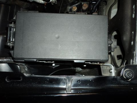 2004 Mercury Grand Marquis - Close-up of a vehicle's fuse box, likely in the engine compartment.
