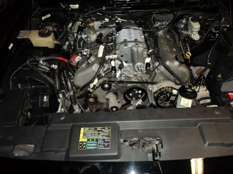 2004 Mercury Grand Marquis - Engine bay a supercharger, likely a performance modification.