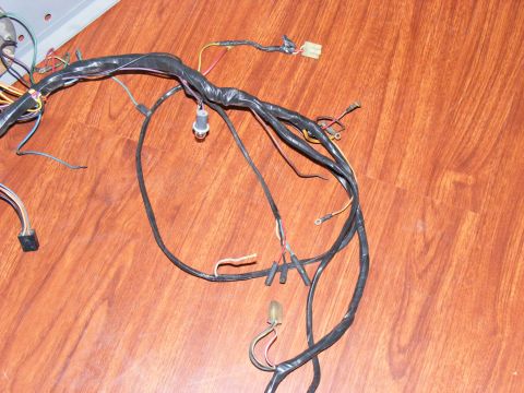 Automotive wiring harness with connectors and a switch