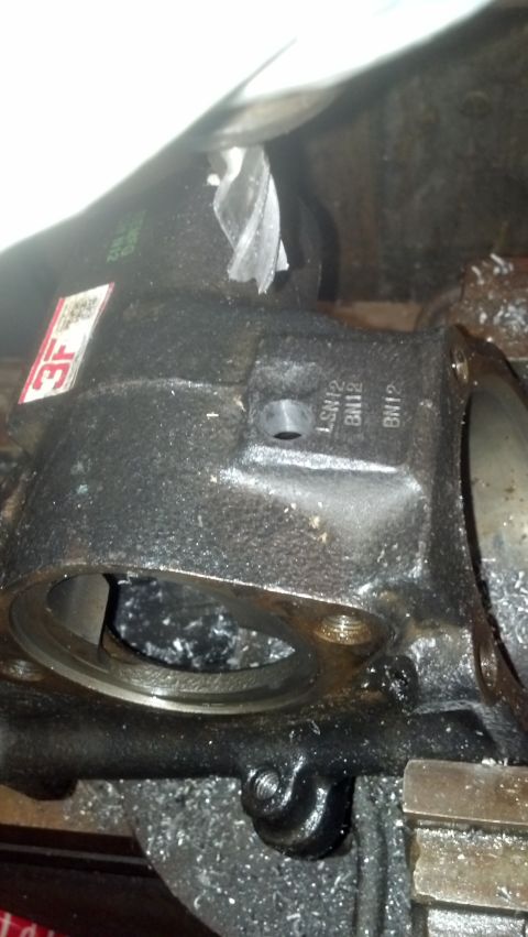 1990 Ford Bronco - Left hand turn pressure port hole milled into the flat spot . It is VERY thick here, no worries about tapping too deep.