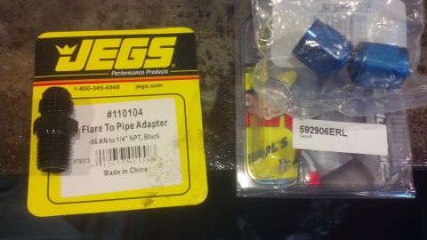 1990 Ford Bronco - JEGS Flare To Pipe Adapter and blue fittings shown in packaging.