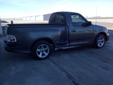 2003 Ford F-150 - Gray 2003 Ford F-150 Lightning pickup truck parked outdoors.