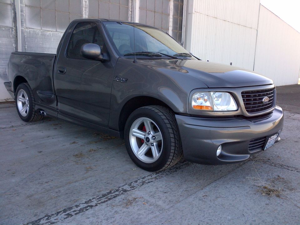 Dark gray Ford F-150 Lightning pickup truck parked outside