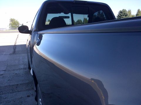 2003 Ford F-150 - The side profile of a dark blue 2003 Ford F-150 pickup truck is captured in this registry photo.