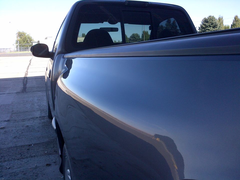 Side view of dark blue 2003 Ford F-150 pickup truck