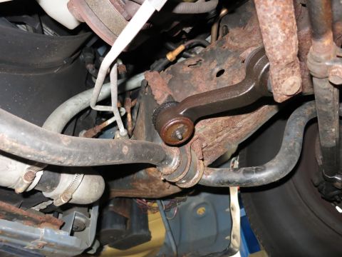 1991 Ford LTD Crown Victoria - Underbody view of heavily corroded suspension parts, likely from an older vehicle.