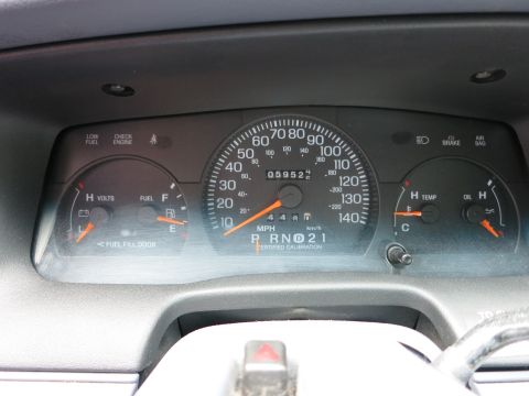 1991 Ford LTD Crown Victoria - The instrument cluster displays the odometer reading of 59,520 miles and various other gauges.
