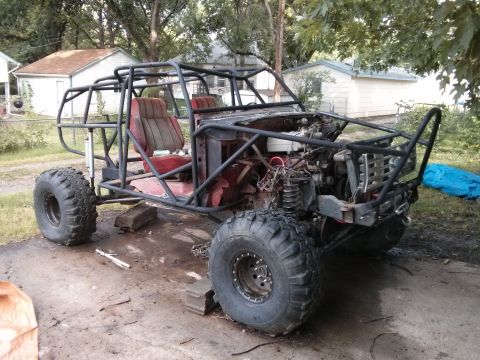 1986 Ford Bronco - This custom buggy is built for off-road use, a full roll cage and oversized tires.