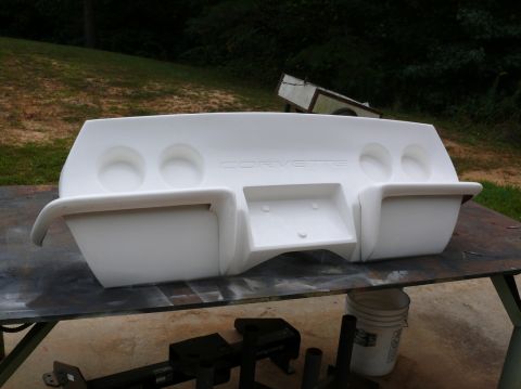 1976 Chevrolet Corvette - This is a white Corvette rear bumper assembly, the embossed 'CORVETTE' name and cutouts for four taillights.