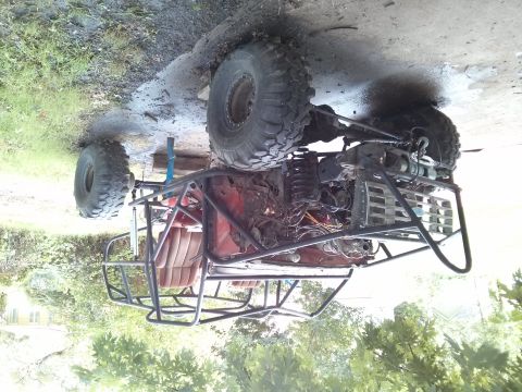 1986 Ford Bronco - This custom-built off-road buggy features a prominent roll cage and large, aggressive tires.