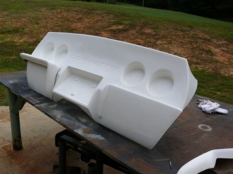 1976 Chevrolet Corvette - A white Corvette rear bumper assembly is shown, ready for installation or repair.