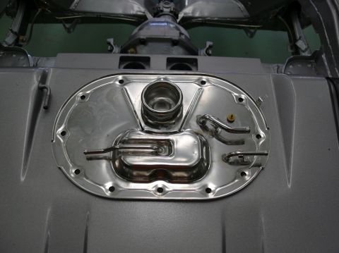 1976 Chevrolet Corvette - Fuel tank sending unit assembly shown from below, likely part of a vehicle restoration.