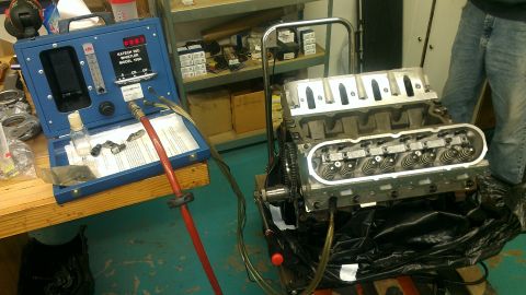 2005 Chevrolet Suburban - A V8 engine block is connected to a K-Tech diagnostic tool, likely for testing or repair.