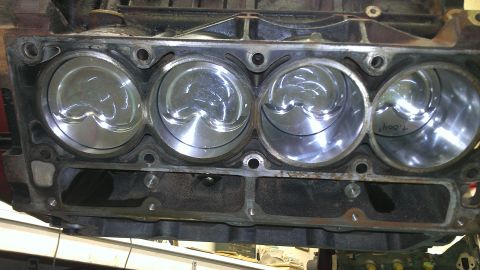 2005 Chevrolet Suburban - Close-up view of an engine block's cylinder bores and pistons, showing internal engine components.