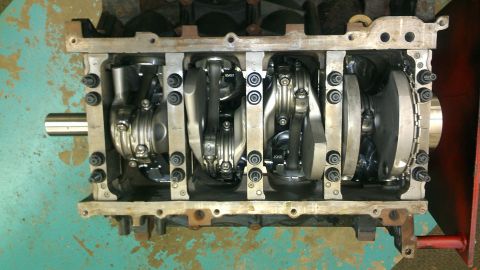2005 Chevrolet Suburban - Close-up view of an engine block's internal components, including the crankshaft and connecting rods.