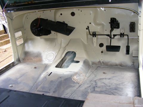 1978 Ford Bronco interior floor pan with pedals and heater assembly visible