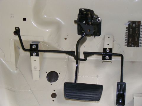 Interior view of clutch and brake pedals with linkage