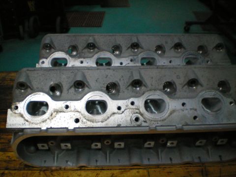 2005 Chevrolet Suburban - Pair of aluminum engine cylinder heads with visible part number 213207612865.