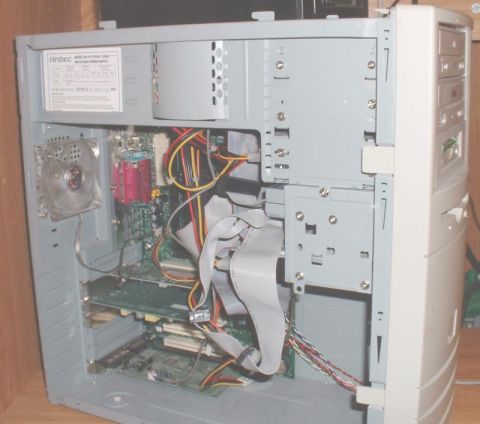 1986 Ford Bronco - Inside view of a computer tower, showing various components and wiring.