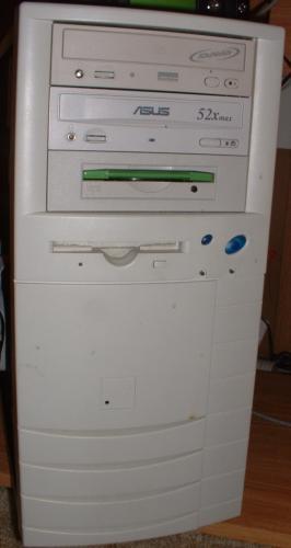 1986 Ford Bronco - A white computer tower is shown with multiple drive bays and a Supermotors logo at the base.