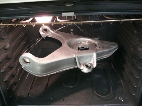 1976 Chevrolet Corvette - A car part is being baked in an oven, likely for a coating or curing process.