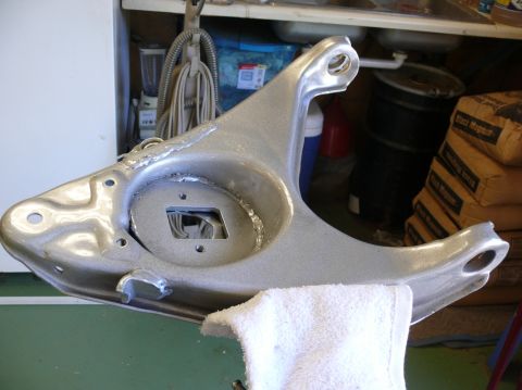 1976 Chevrolet Corvette - A silver suspension control arm is shown in detail, resting on a white towel.