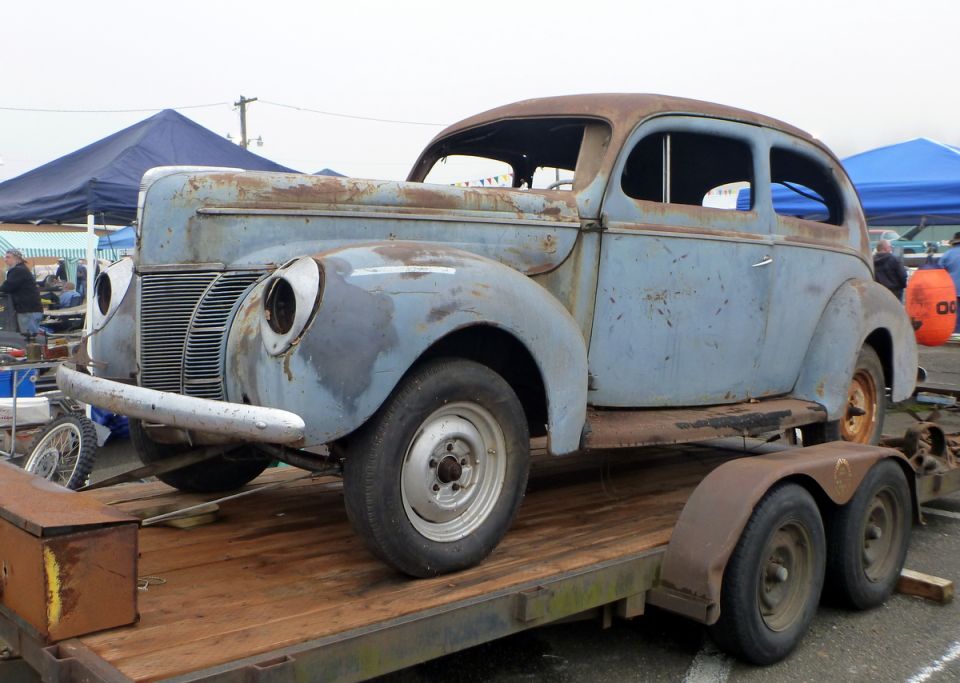 1940 Ford Sedan on trailer, front 3/4 view, light blue