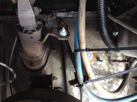 1978 Ford Bronco - Undercarriage view shows various mechanical parts and hoses secured with zip ties.