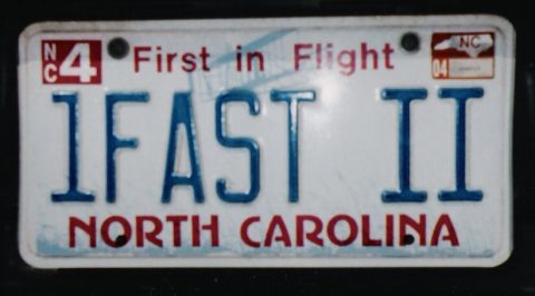 1977 Ford Mustang II - A North Carolina license plate with the vanity text '1FAST II' is shown.