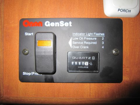 2008 Ford F-450 - Control panel for an Onan GenSet, an hour meter and indicator light information.