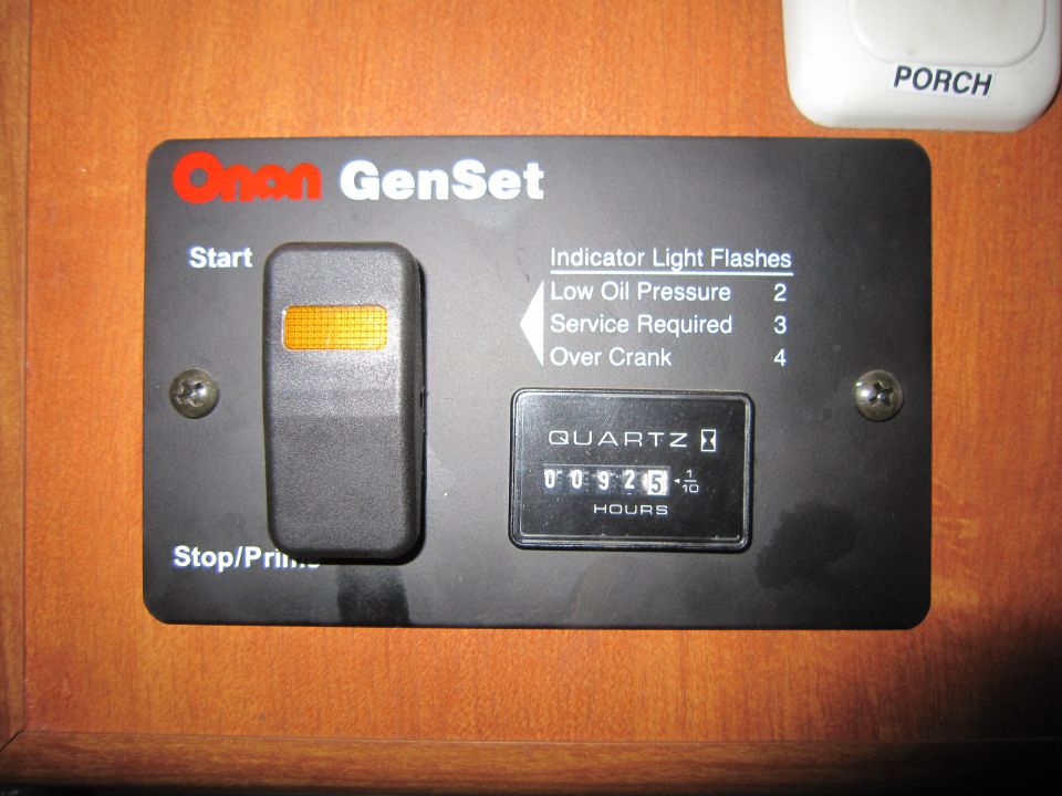Onan GenSet control panel showing 00925.1 hours, with start/stop switches and indicator light information