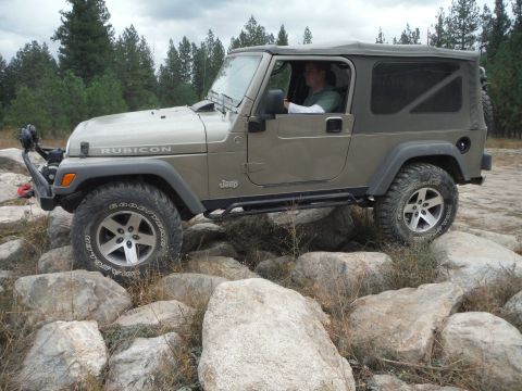 2005 Jeep Wrangler - A Jeep Wrangler Rubicon navigates a rocky terrain, its off-road capabilities.