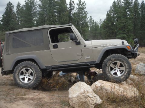 2005 Jeep Wrangler - This Jeep Wrangler Rubicon is navigating a rocky trail, demonstrating its off-road capabilities.