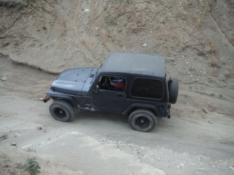 2005 Jeep Wrangler - Black 2005 Jeep Wrangler navigates an off-road trail.