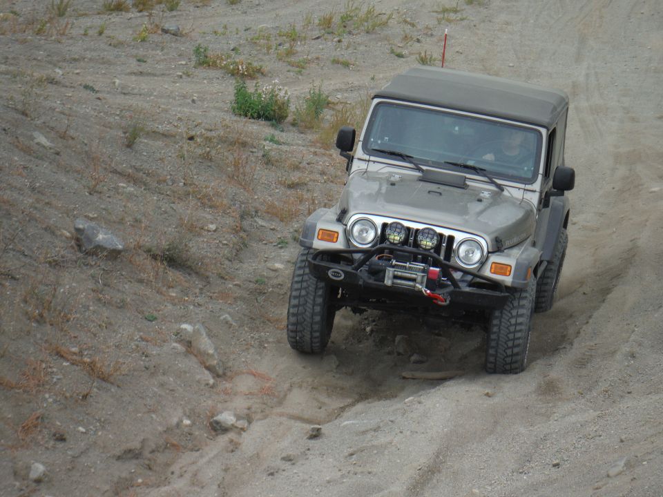 Silver 2005 Jeep Wrangler on dirt trail