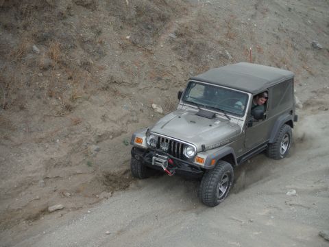 2005 Jeep Wrangler - Silver 2005 Jeep Wrangler Rubicon navigating an off-road trail.