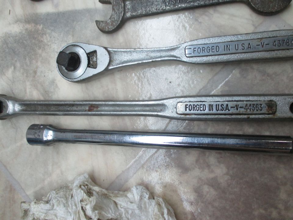 Ratchet wrench and extension bar with "FORGED IN U.S.A." markings