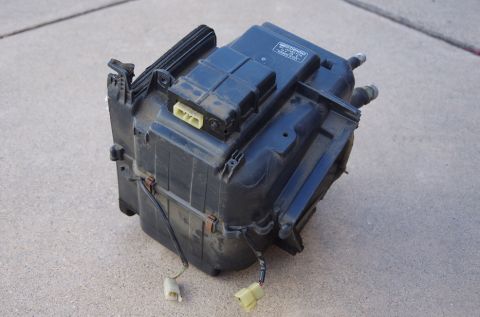 1983 Ferrari Enzo - HVAC blower motor assembly, likely for climate control system, shown on concrete surface.
