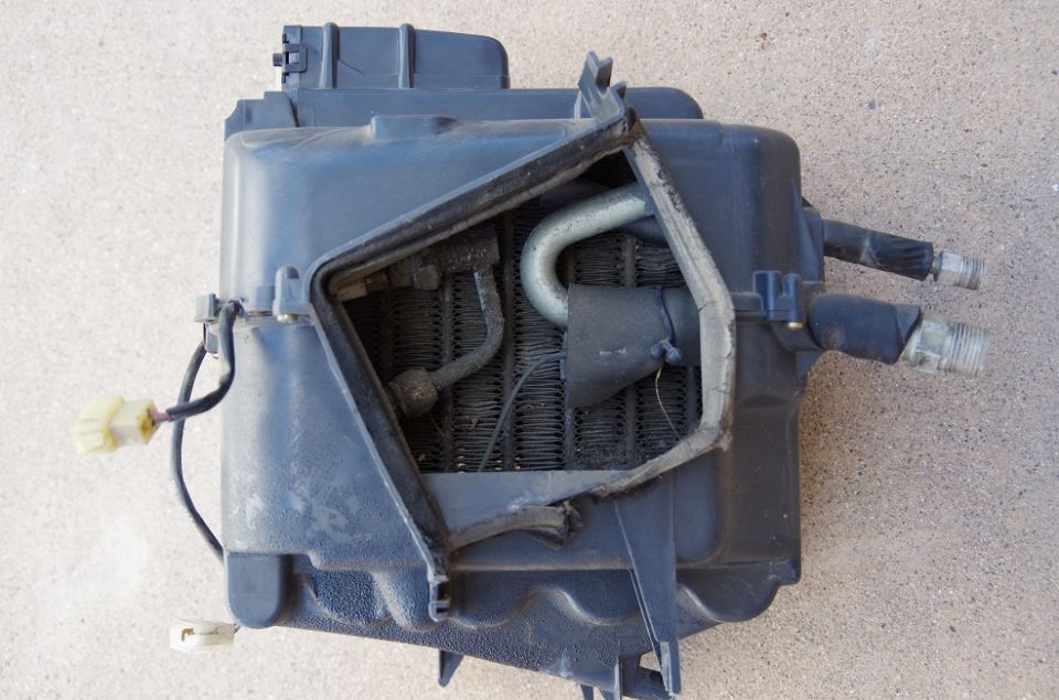 Car heater core assembly with hoses and electrical connectors