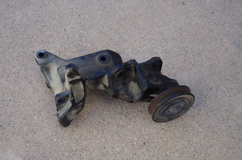 Engine bracket with pulley, dusty black metal