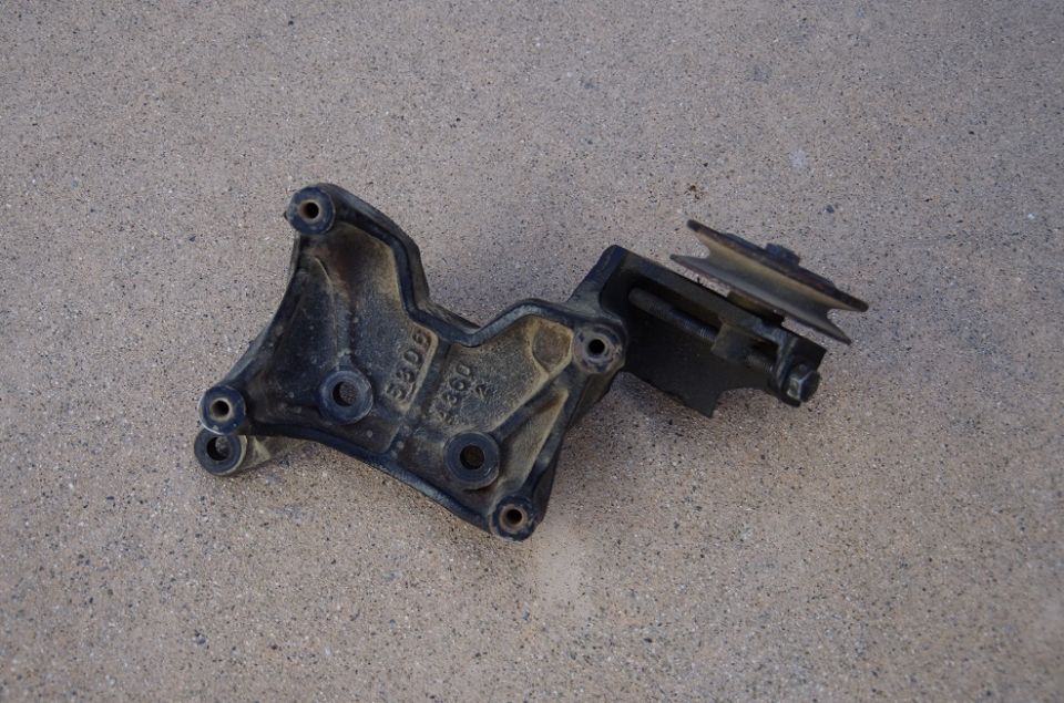 Alternator bracket with pulley, part number 5306 visible