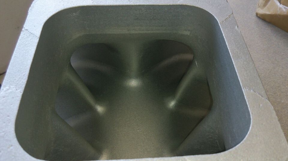 Engine intake port with internal casting marks and a Supermotors.net logo in the corner