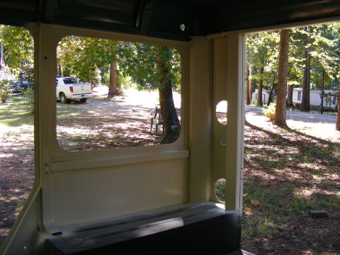 White pickup truck parked outside, seen from inside a vehicle