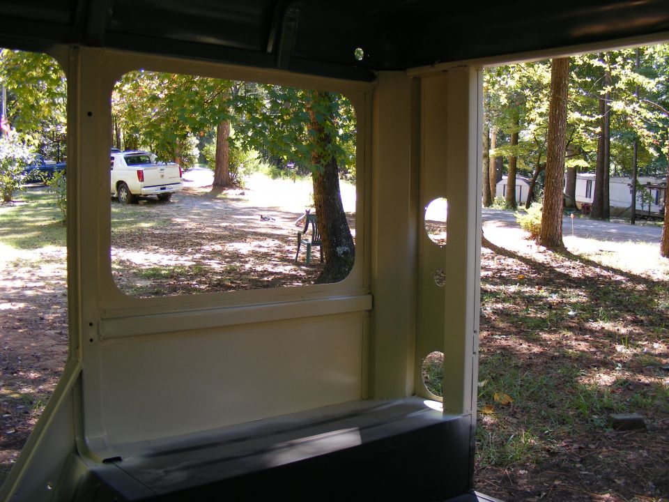 White pickup truck parked outside, seen from inside a vehicle