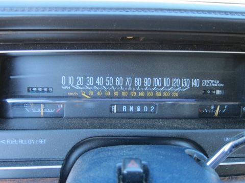 1991 Ford LTD Crown Victoria - Vehicle instrument cluster showing a speedometer to 140 mph, a PRND2 gear indicator, fuel and temperature gauges, and a Certified Calibrati…