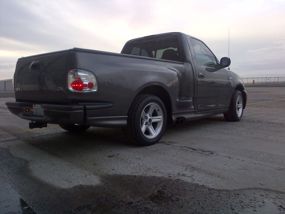 Dark gray 2003 Ford F-150 Lightning rear 3/4 view