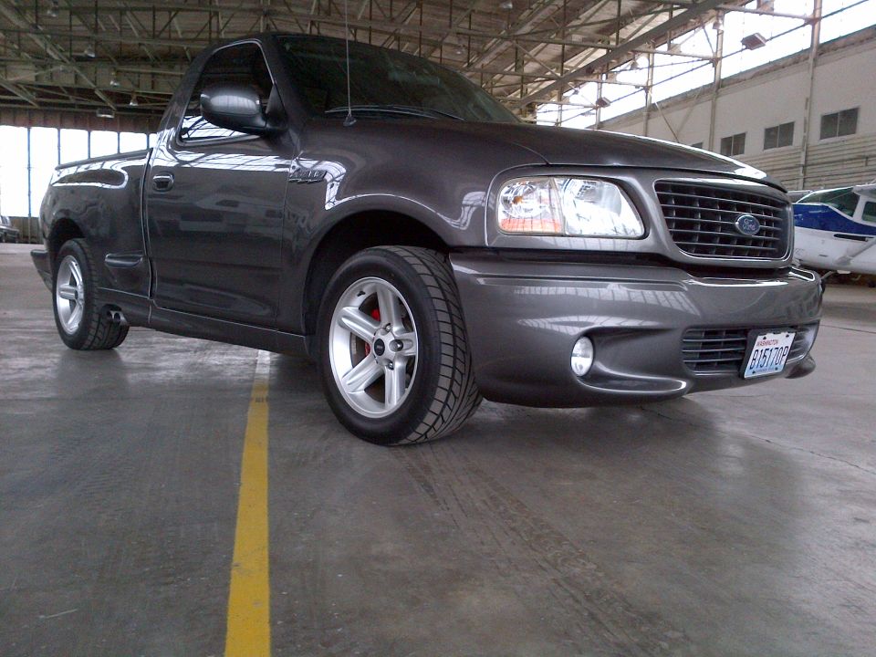 Dark gray 2003 Ford F-150 Lightning pickup truck, front 3/4 view